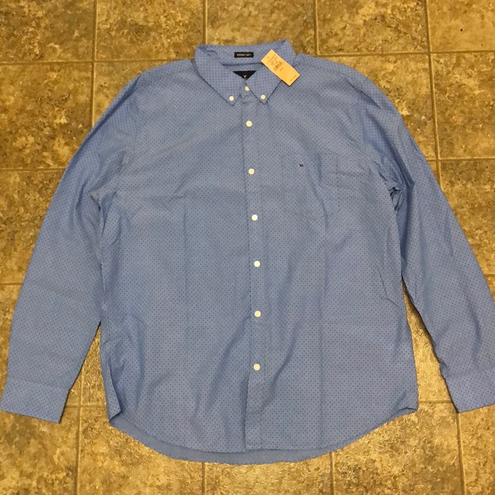 Sky blue long sleeve shirt w/ dark blue polka dots